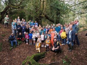 image: Forest of Dean Climate Choir singing in Lambsquay Woods 22 March 2026
