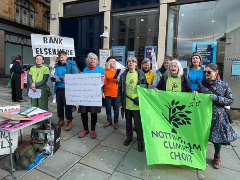 Nottingham Climate Choir singing outside Barclays
